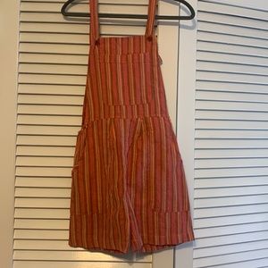 Striped pink and orange low cut romper